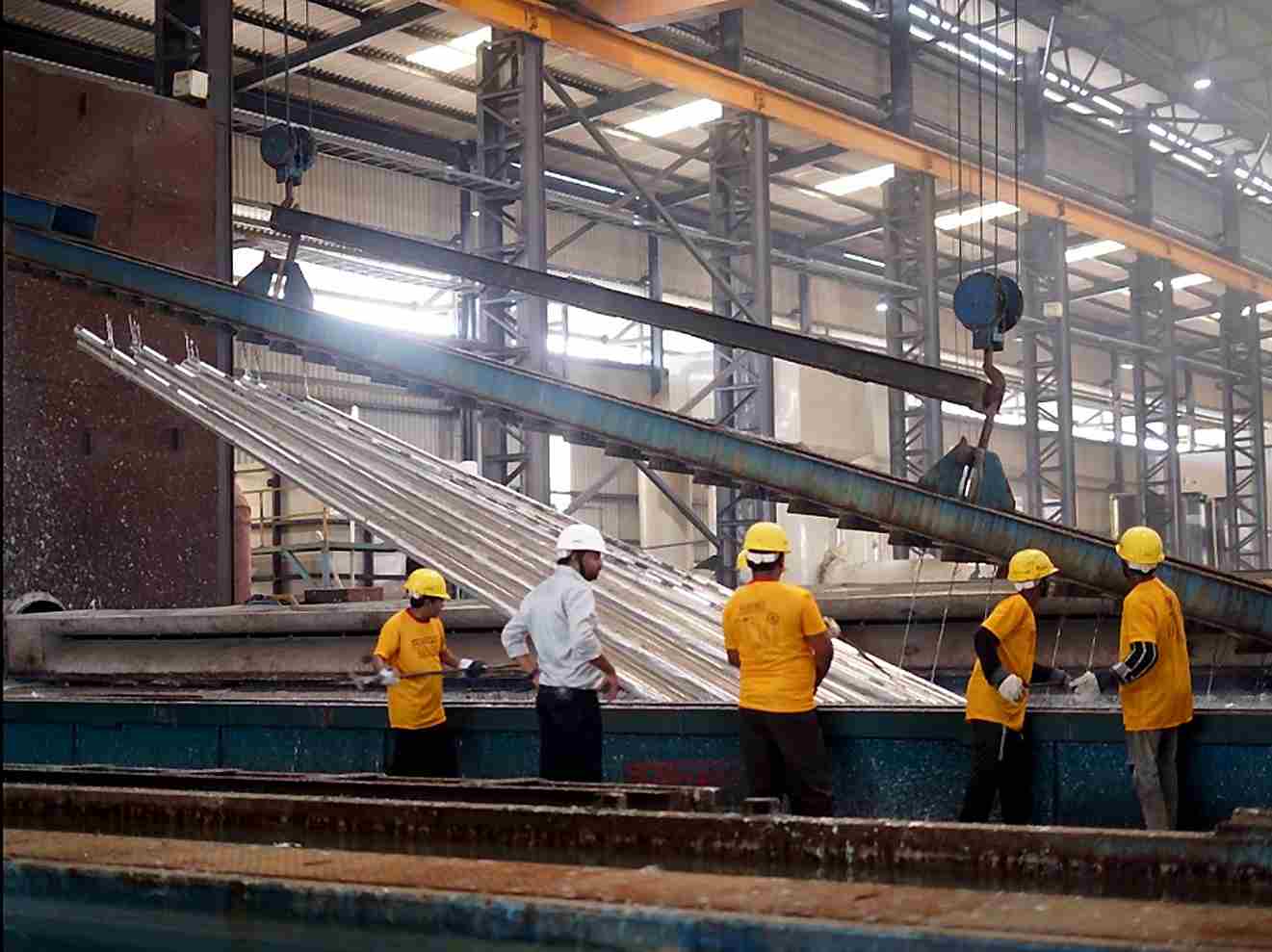 Hot-dip galvanizing of steel street light poles at Subham Poles manufacturing unit in West Bengal
